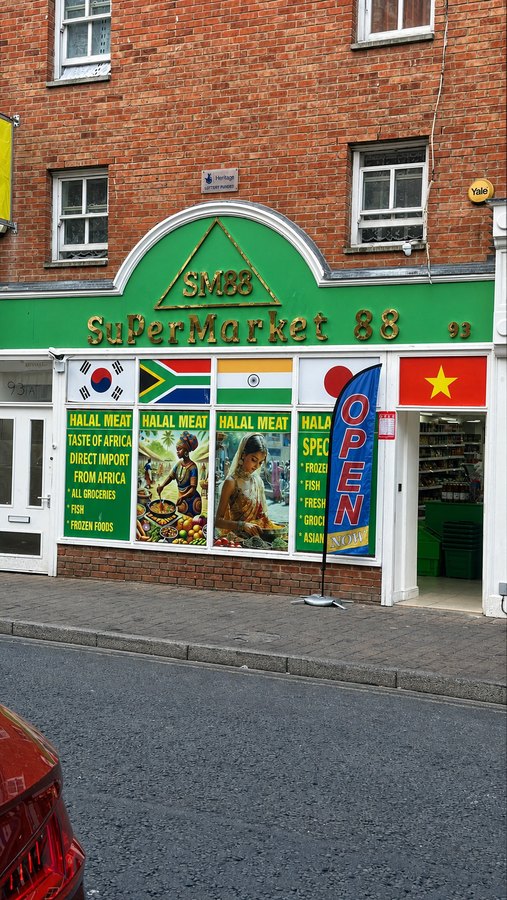 SM88 Supermarket 88 green and gold shopfront on Eastgate Street Gloucester